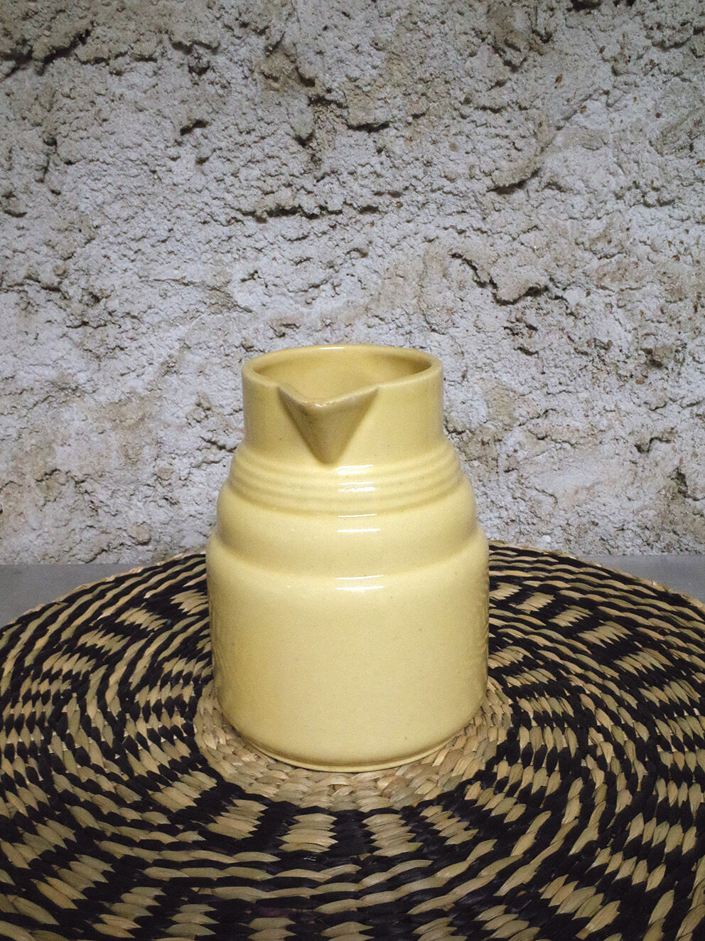 Pastel yellow ceramic pitcher