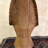 High-backed chair or shepherdess in vintage wicker