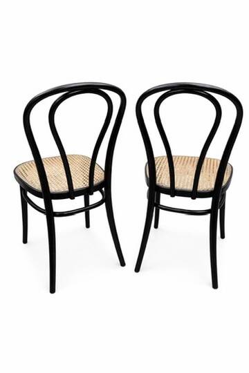 Pair of black curved wooden bistro chairs with caning in Thonet style.