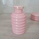 Set of pink and gold ceramic bathroom accessories