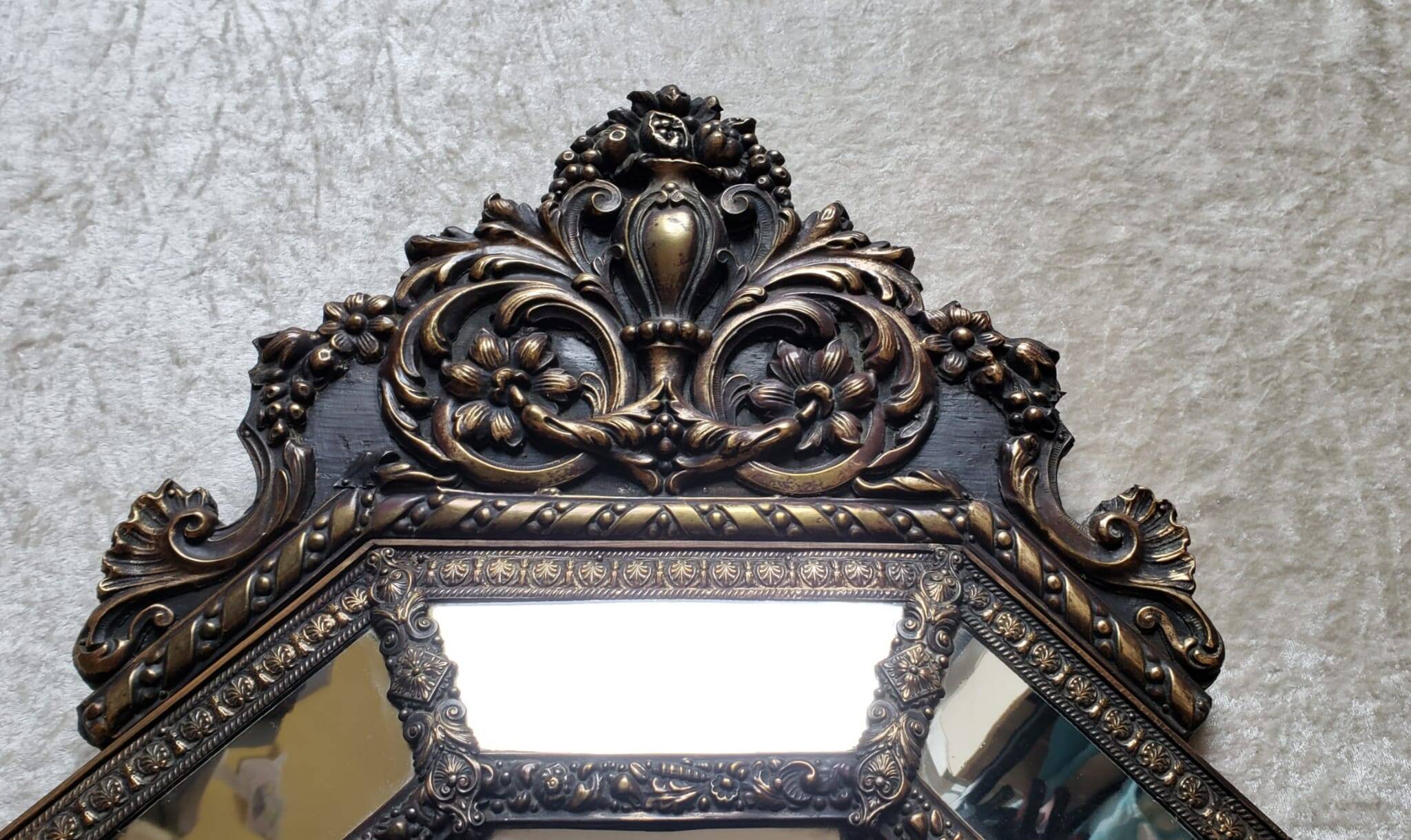 Old octagonal mirror with brass glazing beads