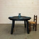 Brutalist round table in burnt wood yakisugi