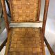 Former colonial armchairs in braided leather