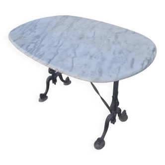 Antique cast iron and marble bistro restaurant table