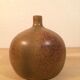 Sandstone ball vase signed Michel Dumont