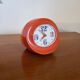 Vintage mechanical alarm clock in orange plastic Uti West Germany