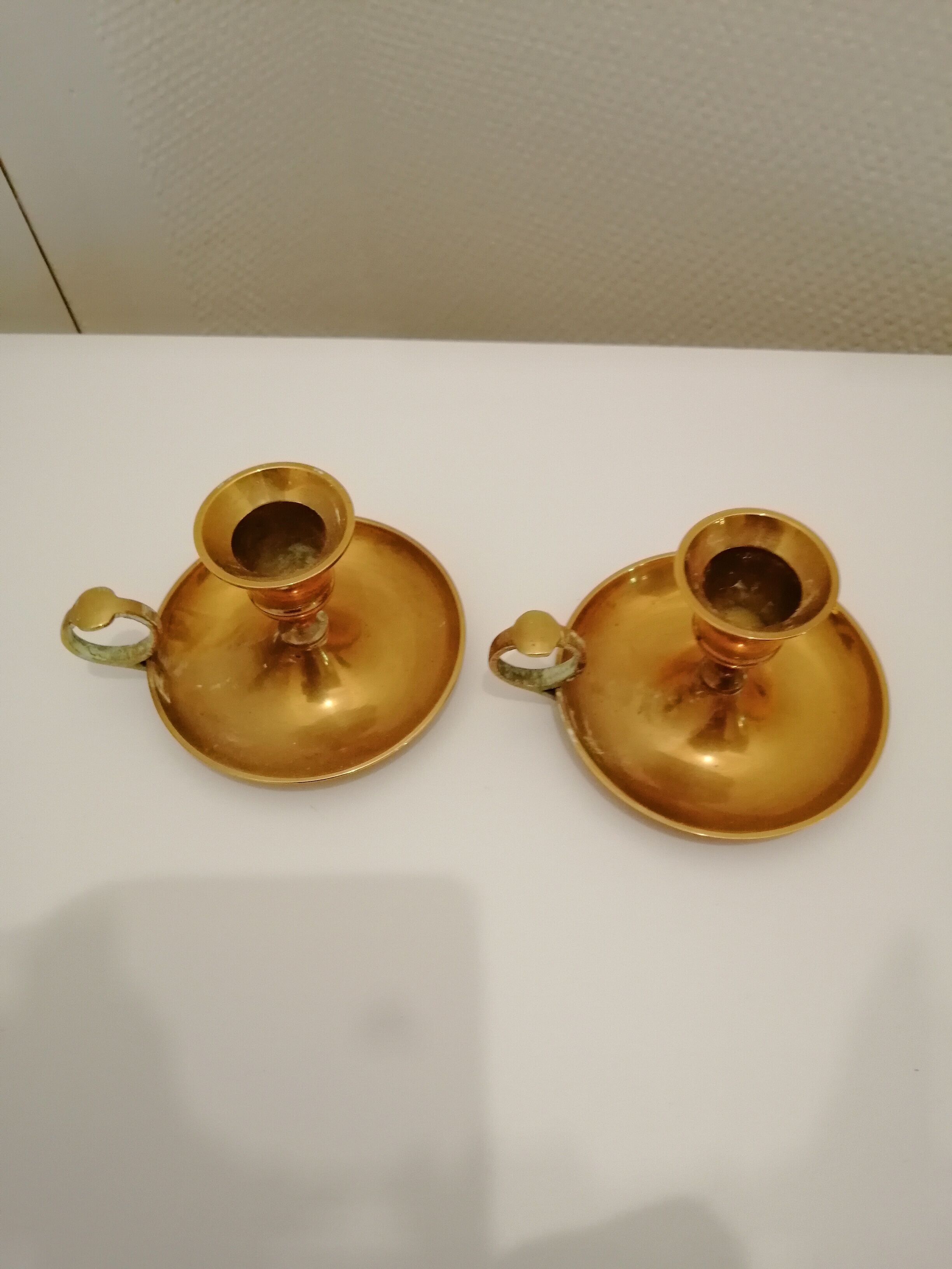 A PAIR OF SMALL COPPER CANDLE HOLDERS