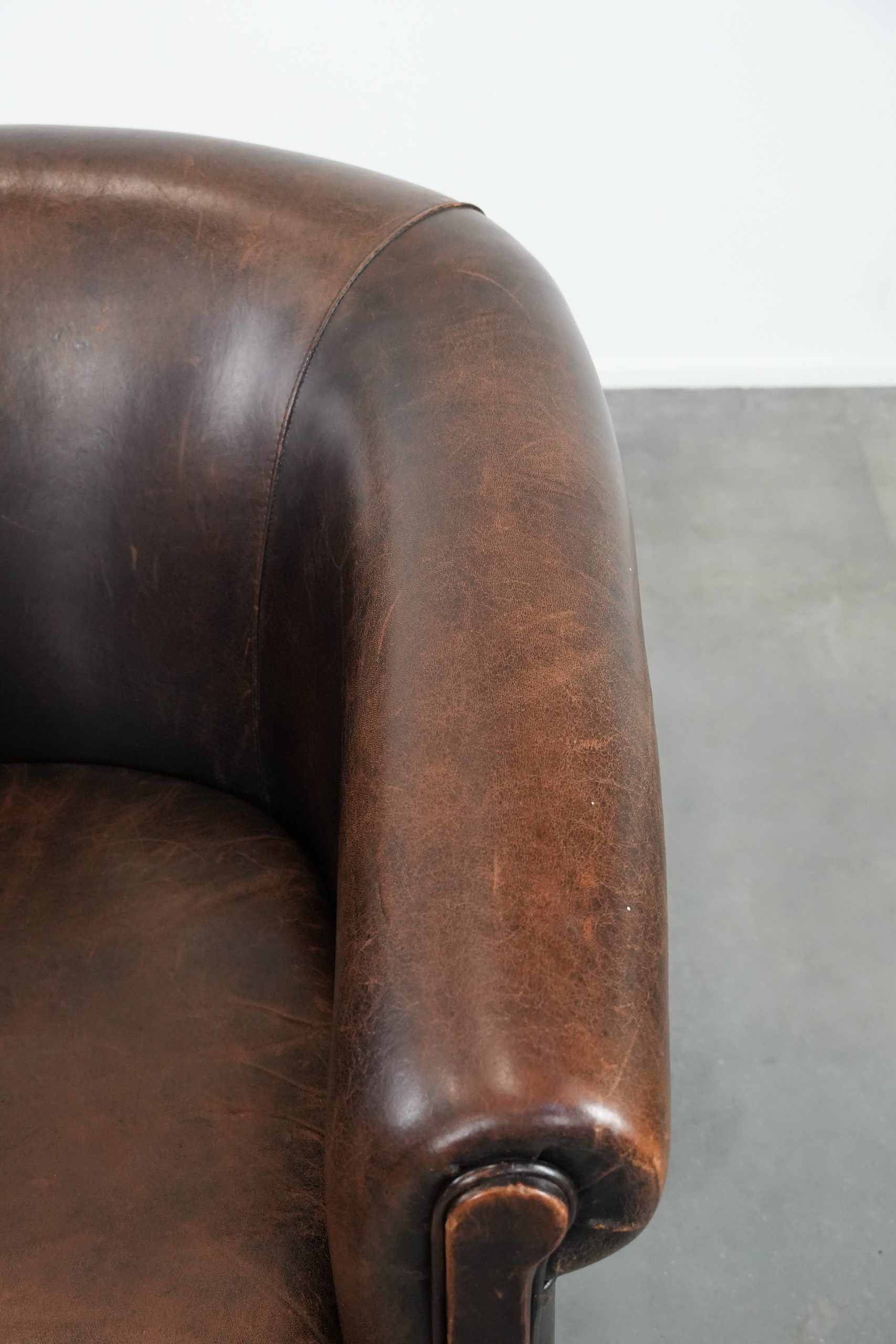 Characterful club armchair made of sheepskin with a beautiful patina