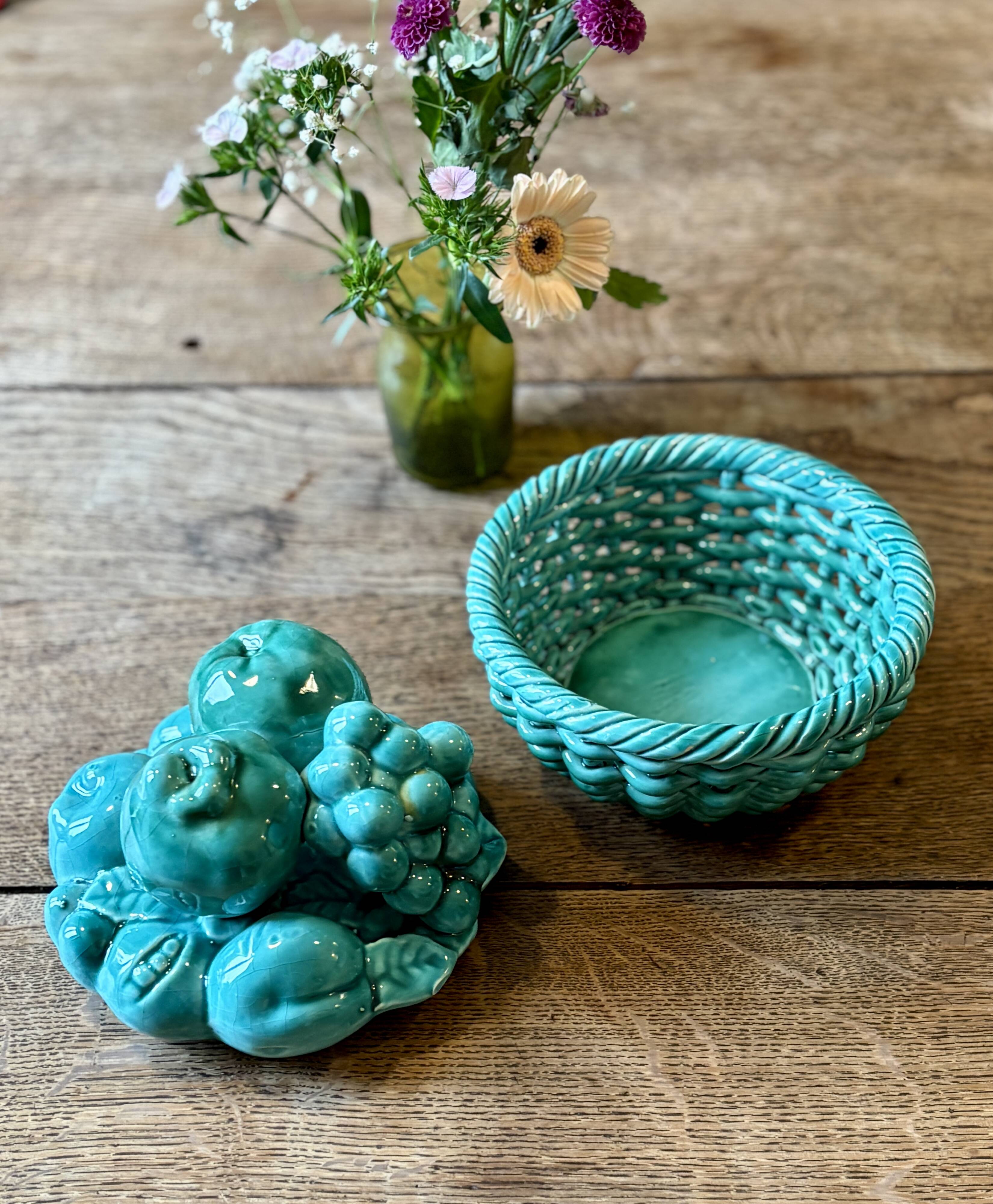Vintage green earthenware plate/basket with fruit decorations.