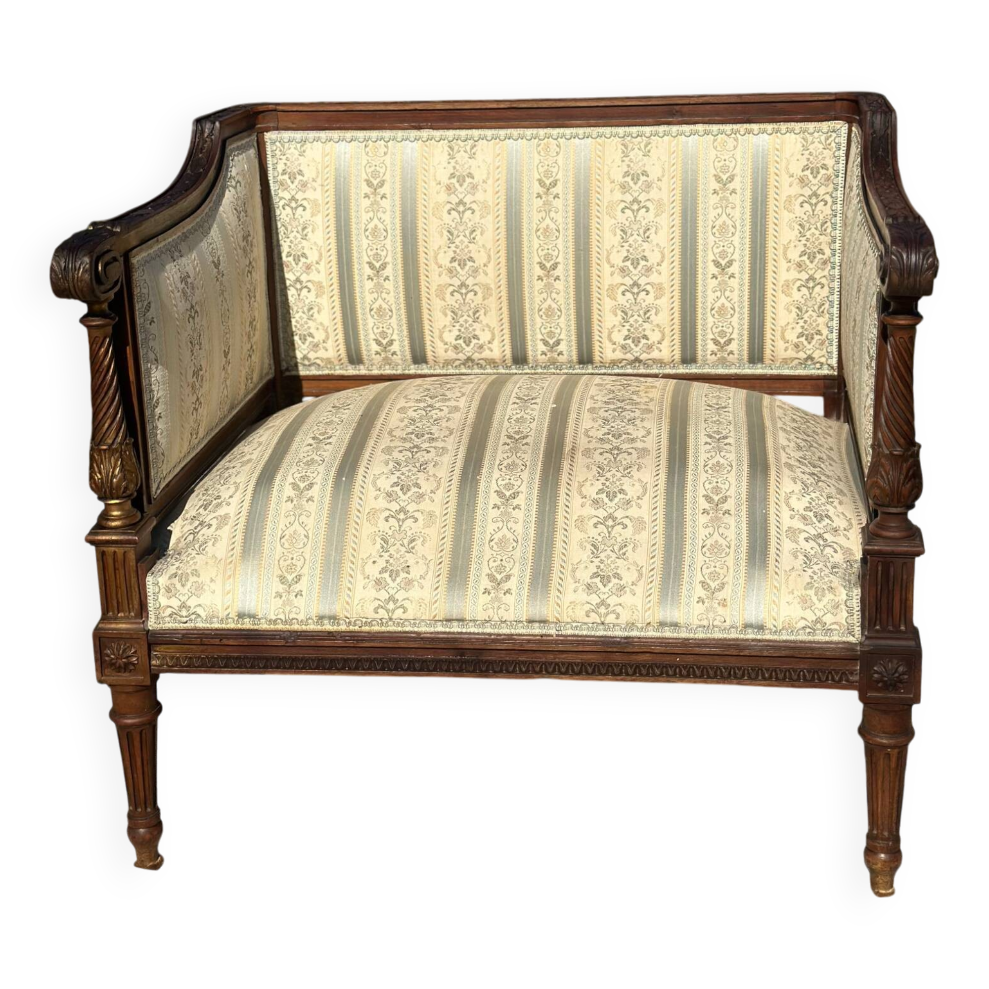 Low armchair in finely carved wood in the Louis XVI style from the 19th century