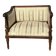 Low armchair in finely carved wood in the Louis XVI style from the 19th century