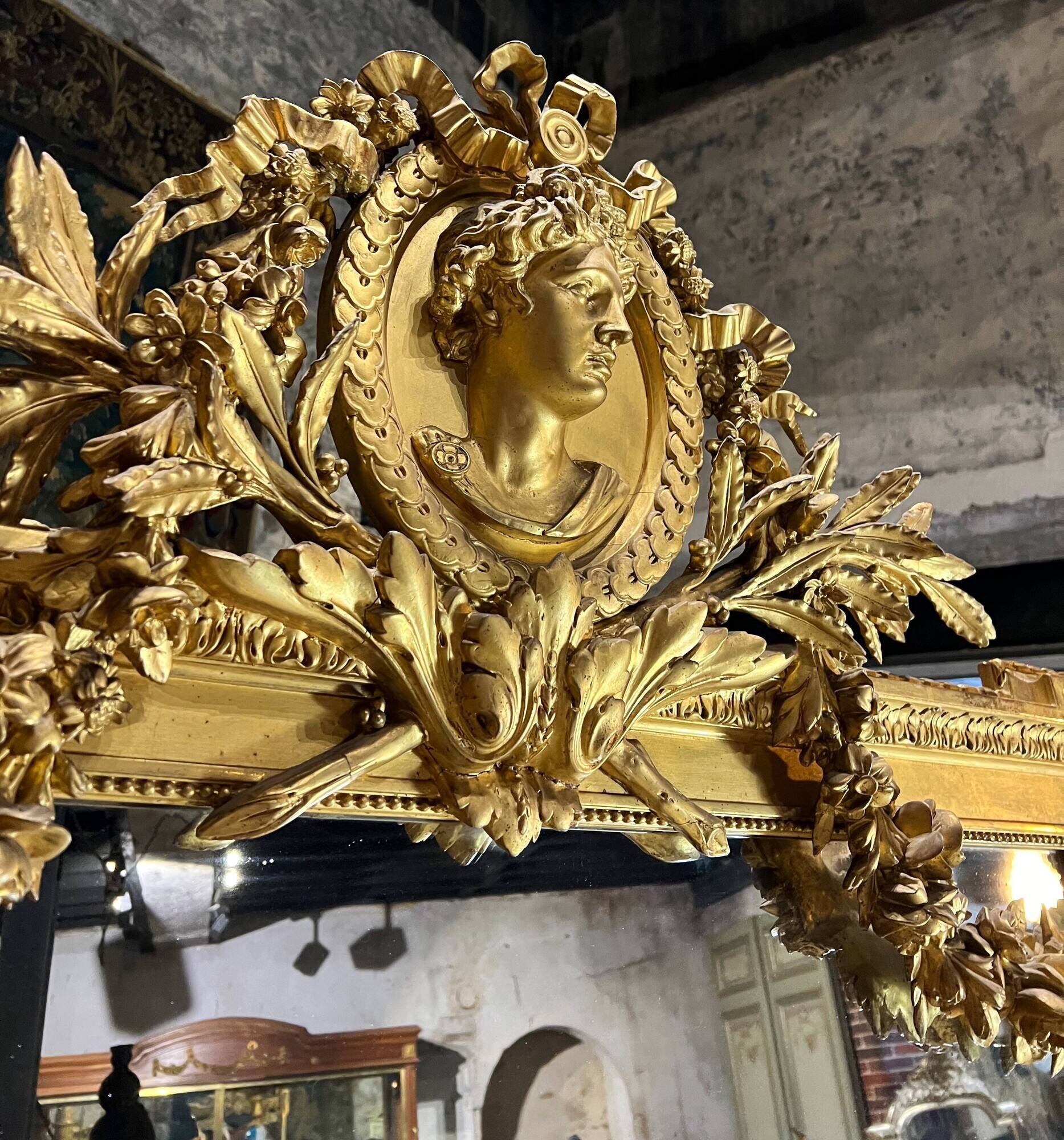 Monumental mirror Napoleon III in gilded wood with the profile of Apollo