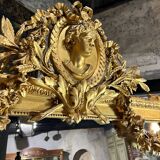 Monumental mirror Napoleon III in gilded wood with the profile of Apollo