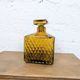 Amber glass liqueur carafe with diamond pattern