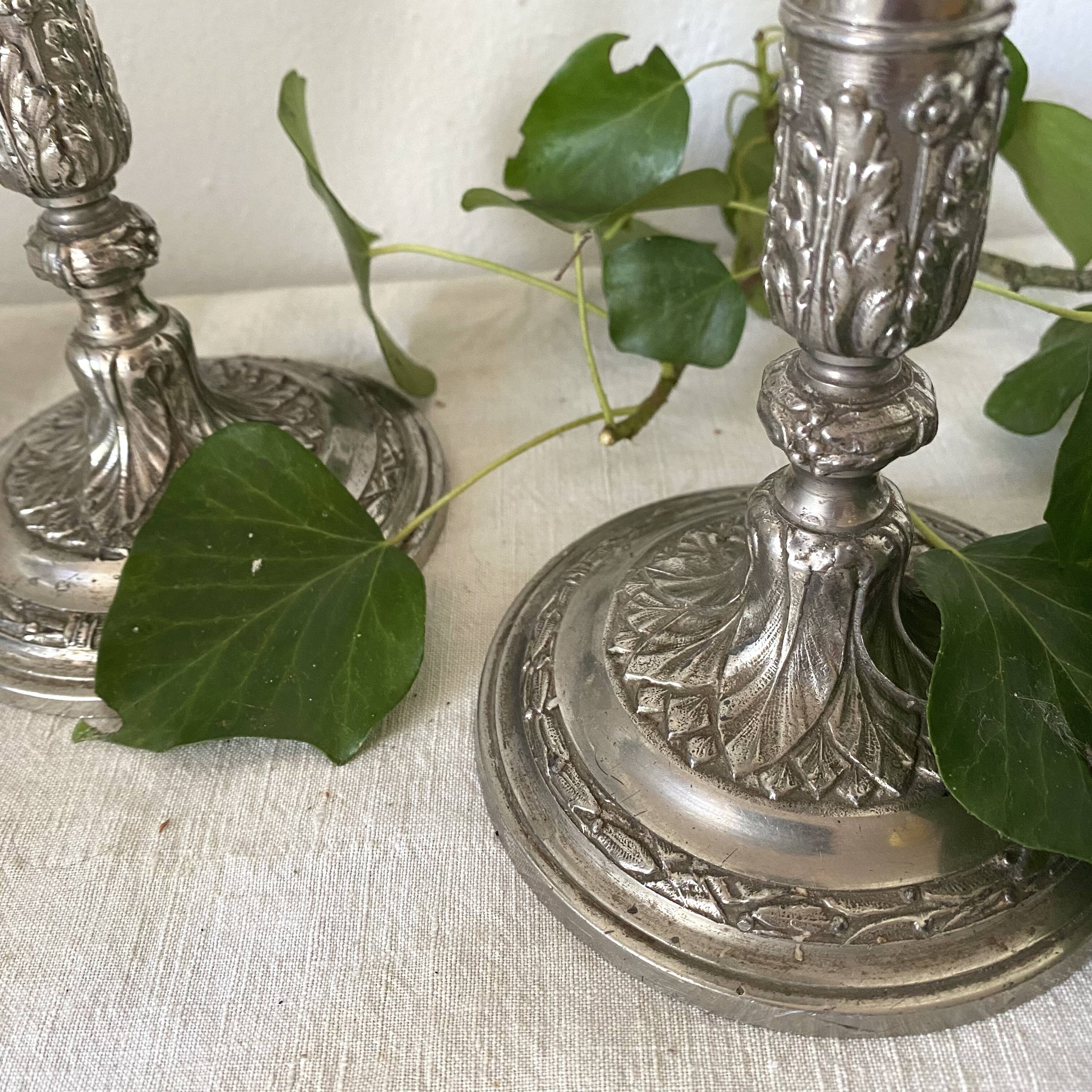 Pair of old silver-plated candlesticks