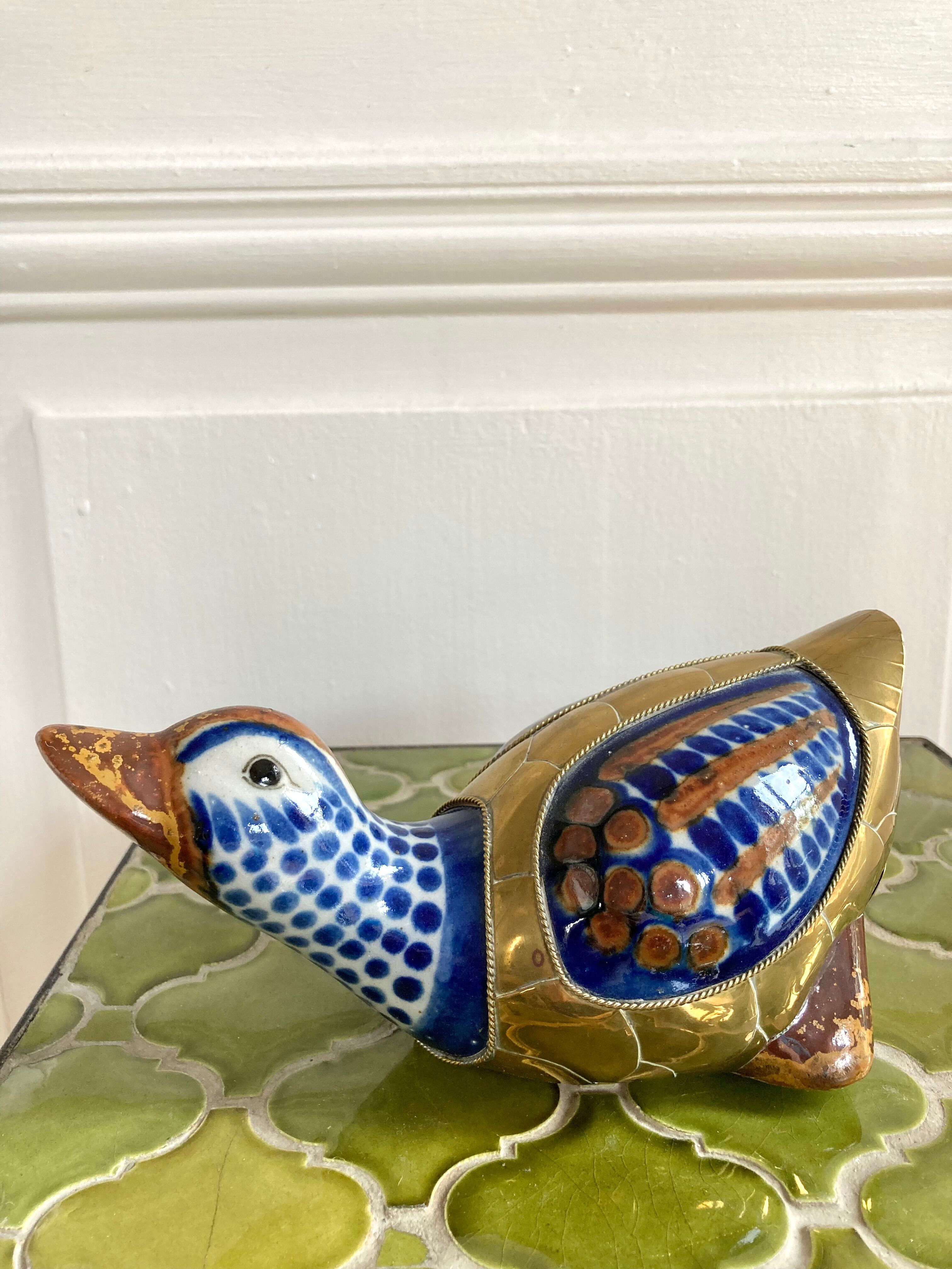 Brass duck and ceramic