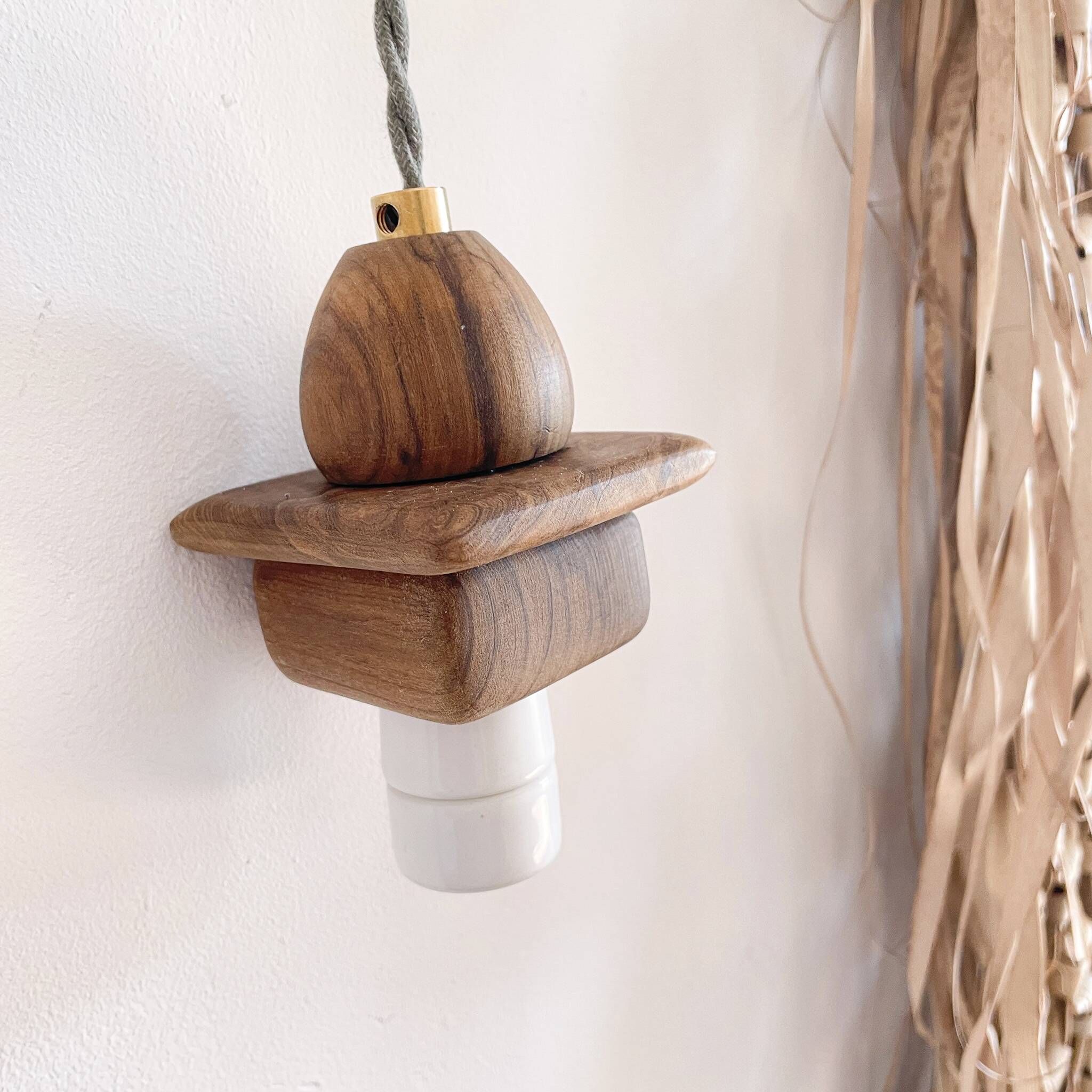 Wooden portable lamp with green cable
