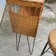 Vintage 1950s bar counter with its two rattan and metal stools.