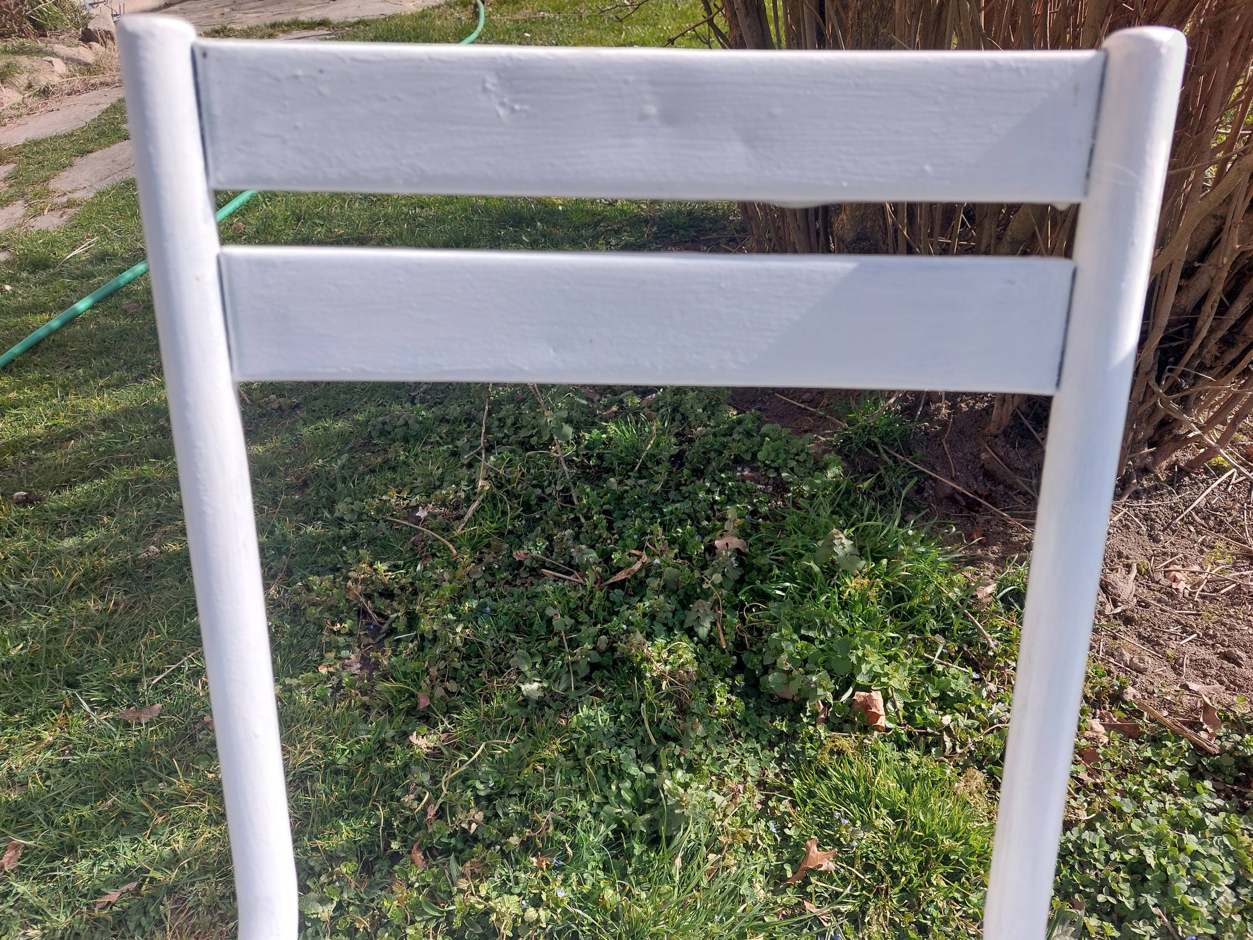 pair of white metal chairs, Tolix style