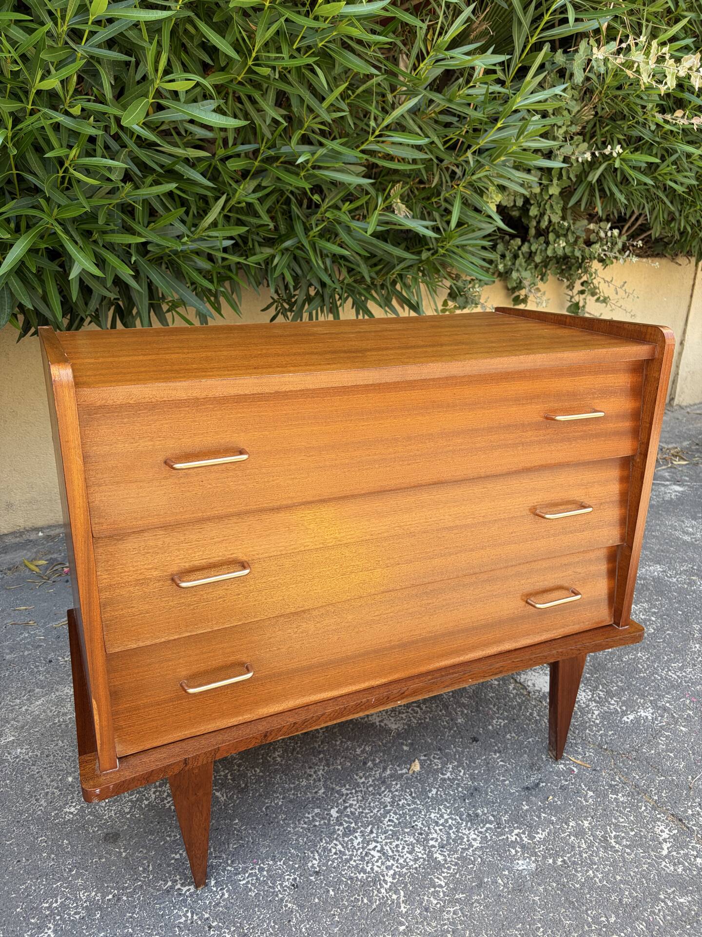 Vintage 1950s small chest of drawers with compass legs.