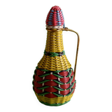 Glass bottle covered with multicolored scoubidou
