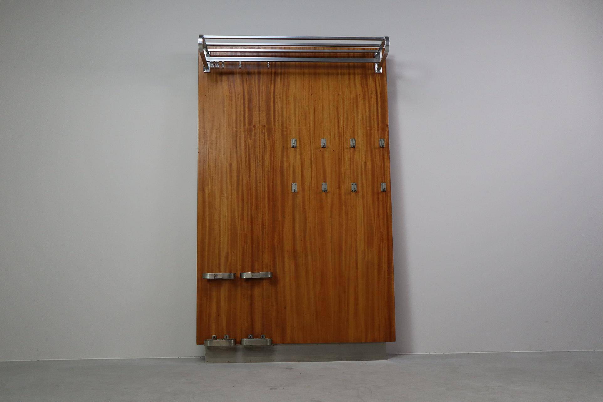 Modernist wall-mounted cloakroom in teak