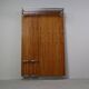 Modernist wall-mounted cloakroom in teak