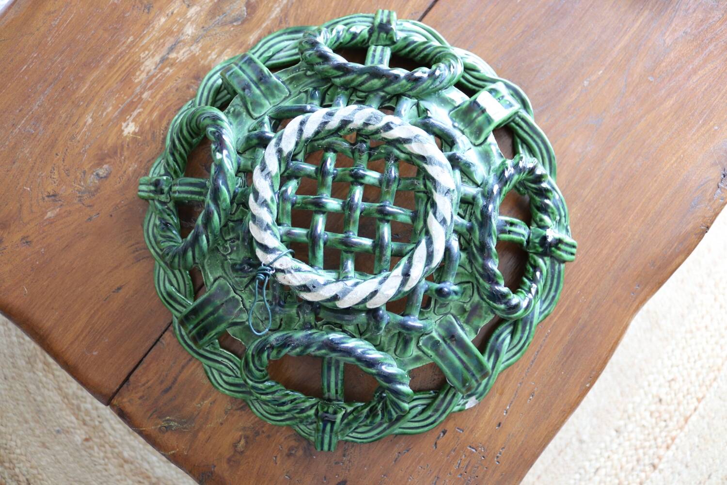 Antique woven basket in green glazed ceramic, fish decoration