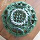Antique woven basket in green glazed ceramic, fish decoration