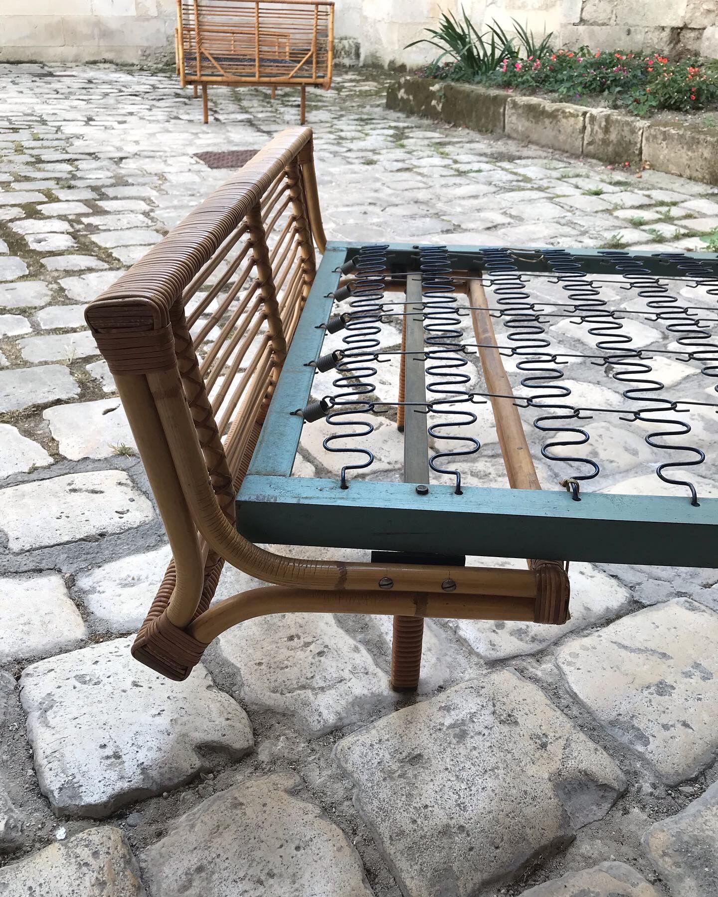 Twin rattan beds with built-in bedside tables