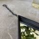 Miroir brutaliste losange en fer