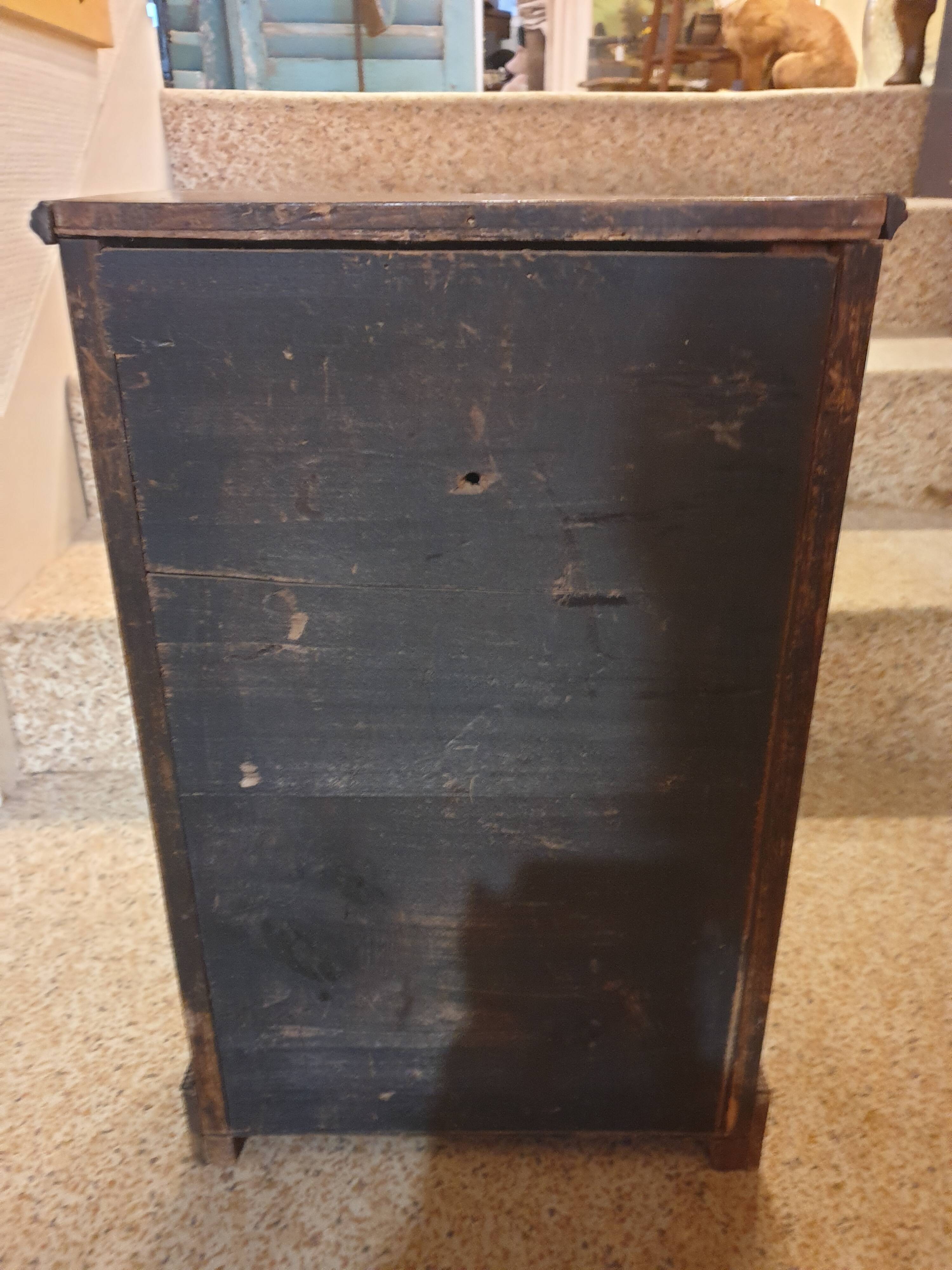 Antique doll cabinet
