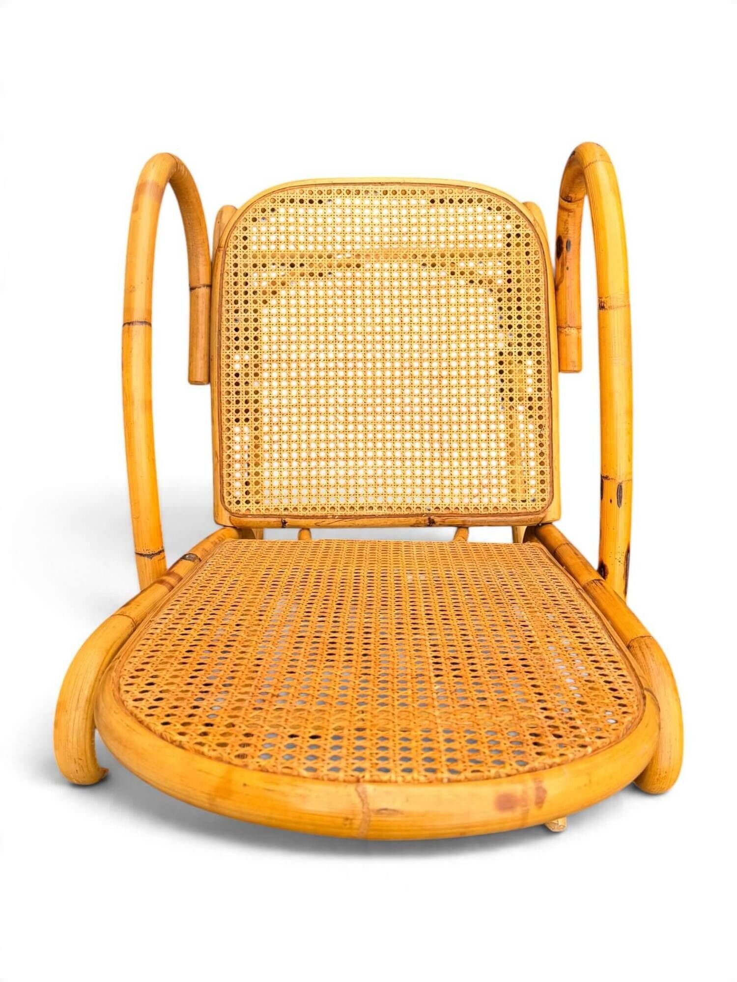 Vintage rocking chair in bamboo and cane