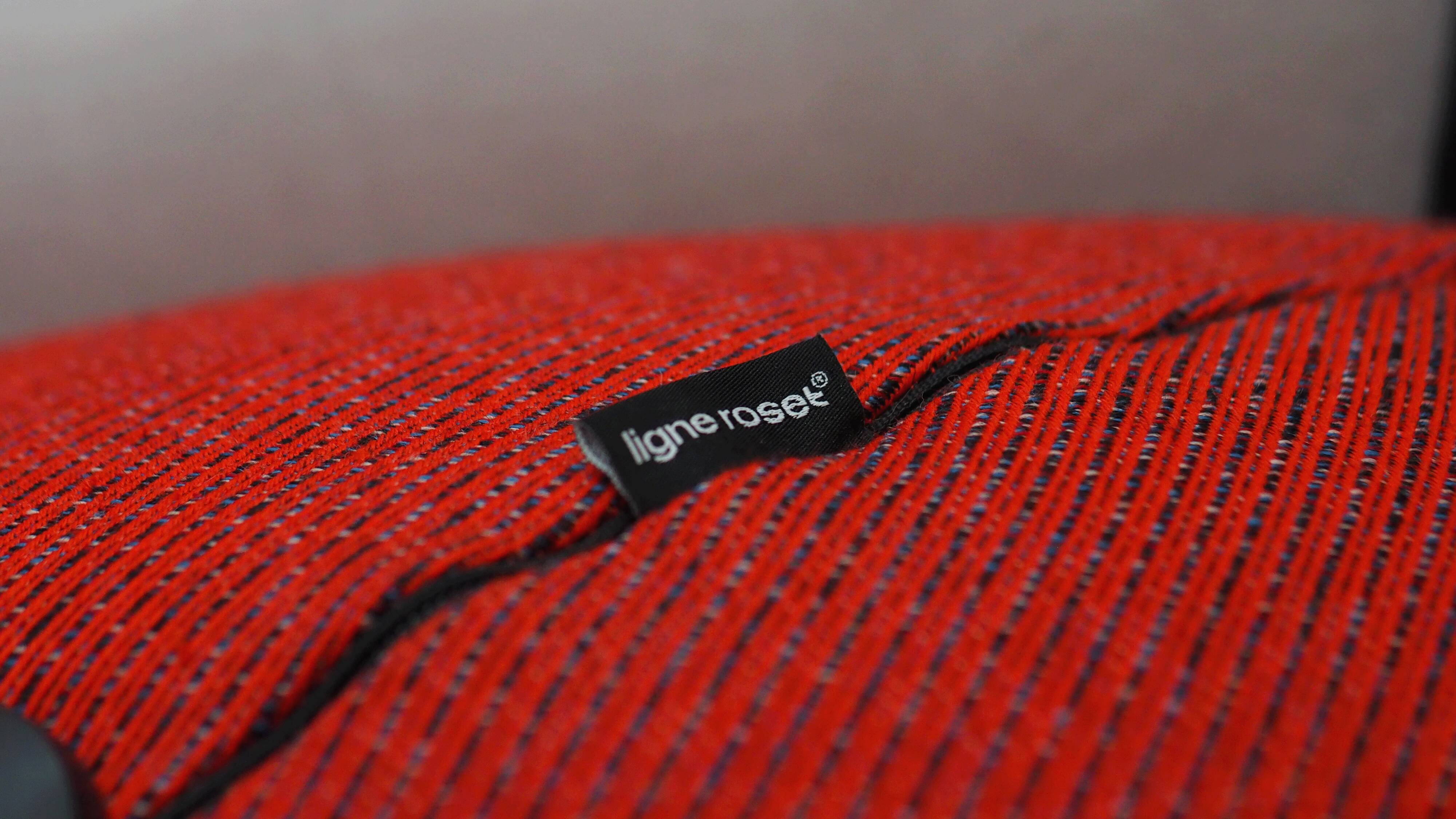 Pouf Ligne Roset, red tweed fabric, excellent condition.