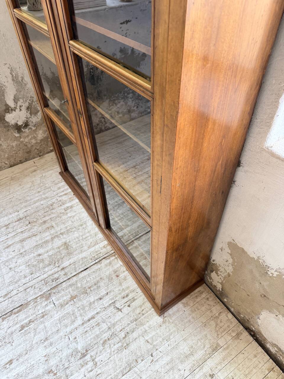Glass-fronted walnut library 1900