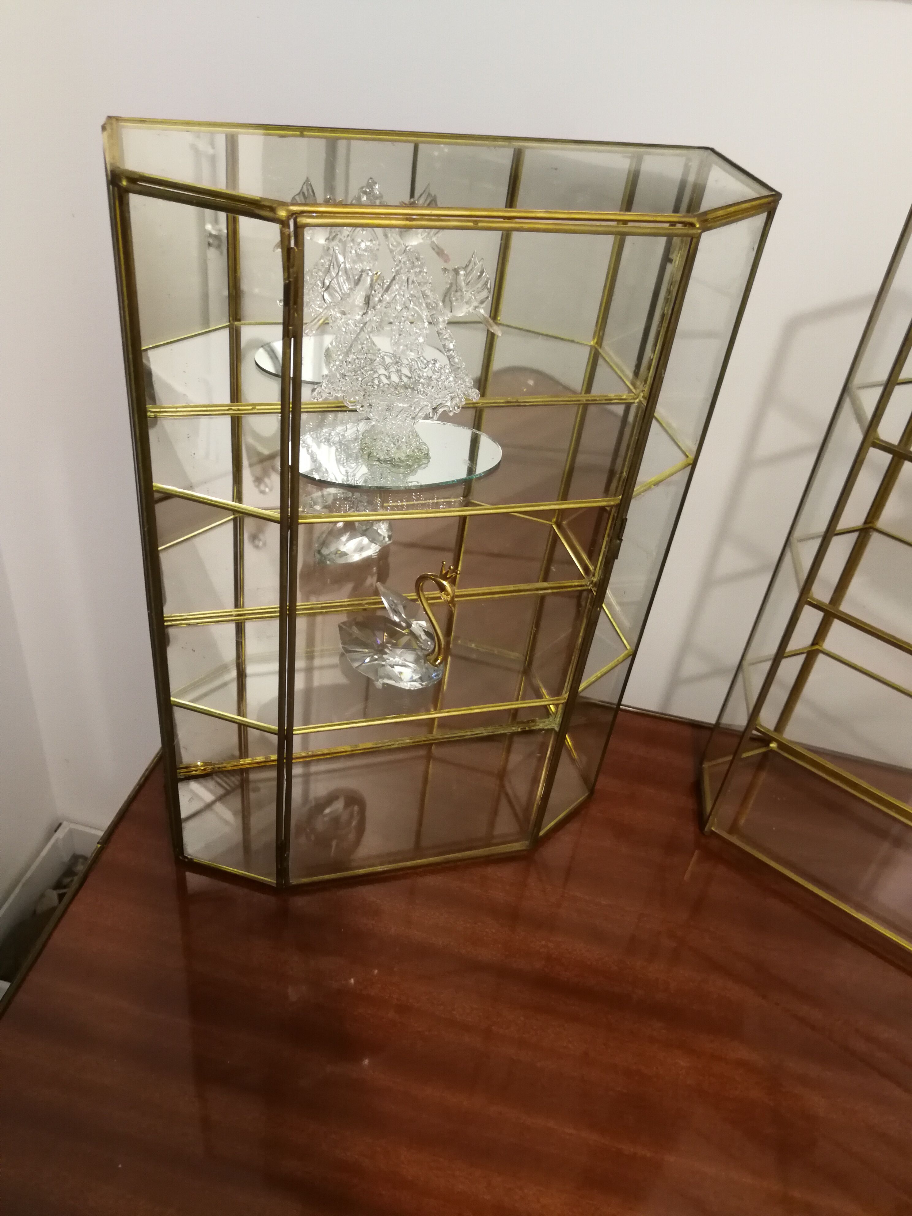 Duo of brass and glass showcases