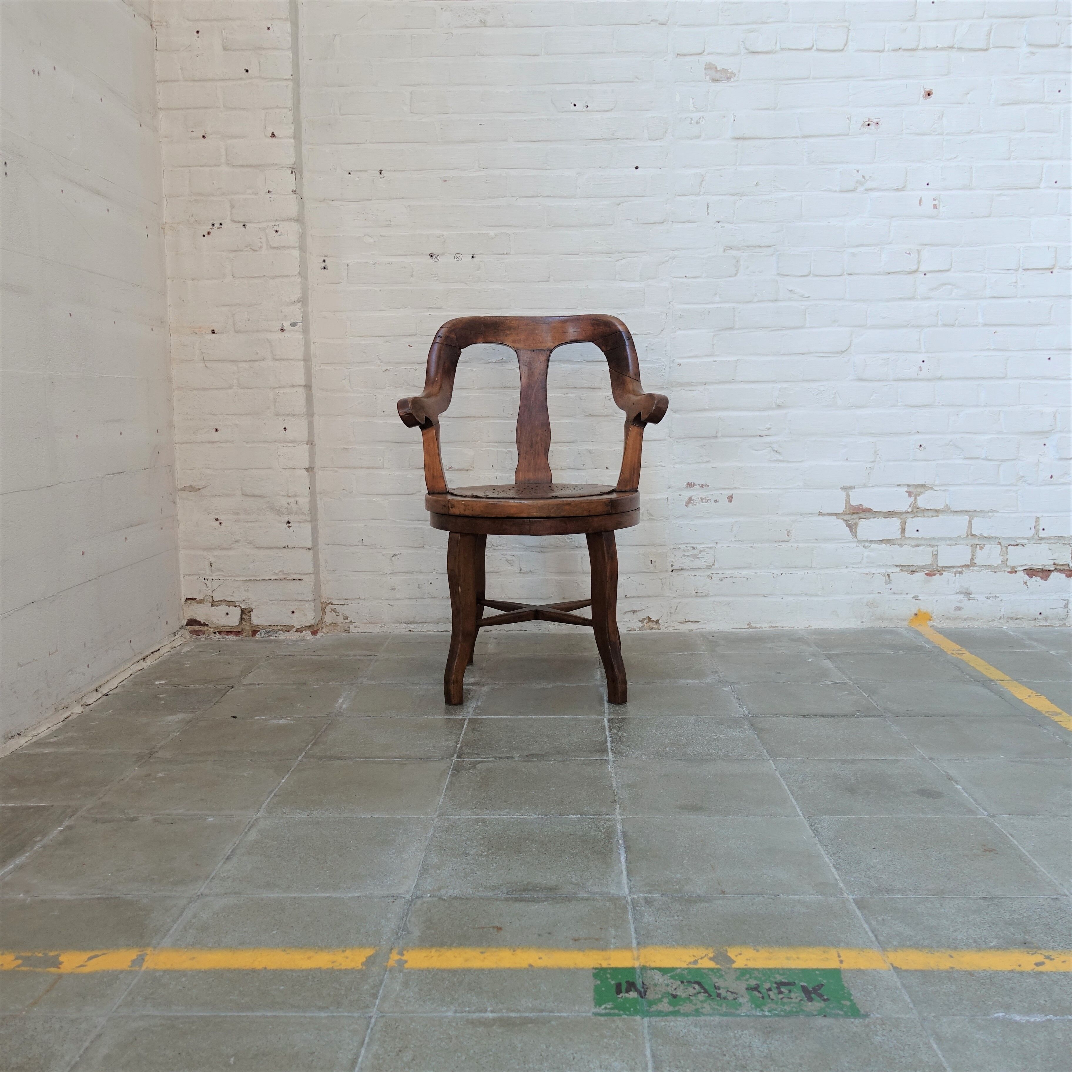 Antique oakwood barber armchair