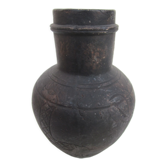 Black African pottery with stylized giraffe pattern