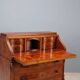 Antique drop-leaf table in walnut with maple inlays, Italy, 20th century.