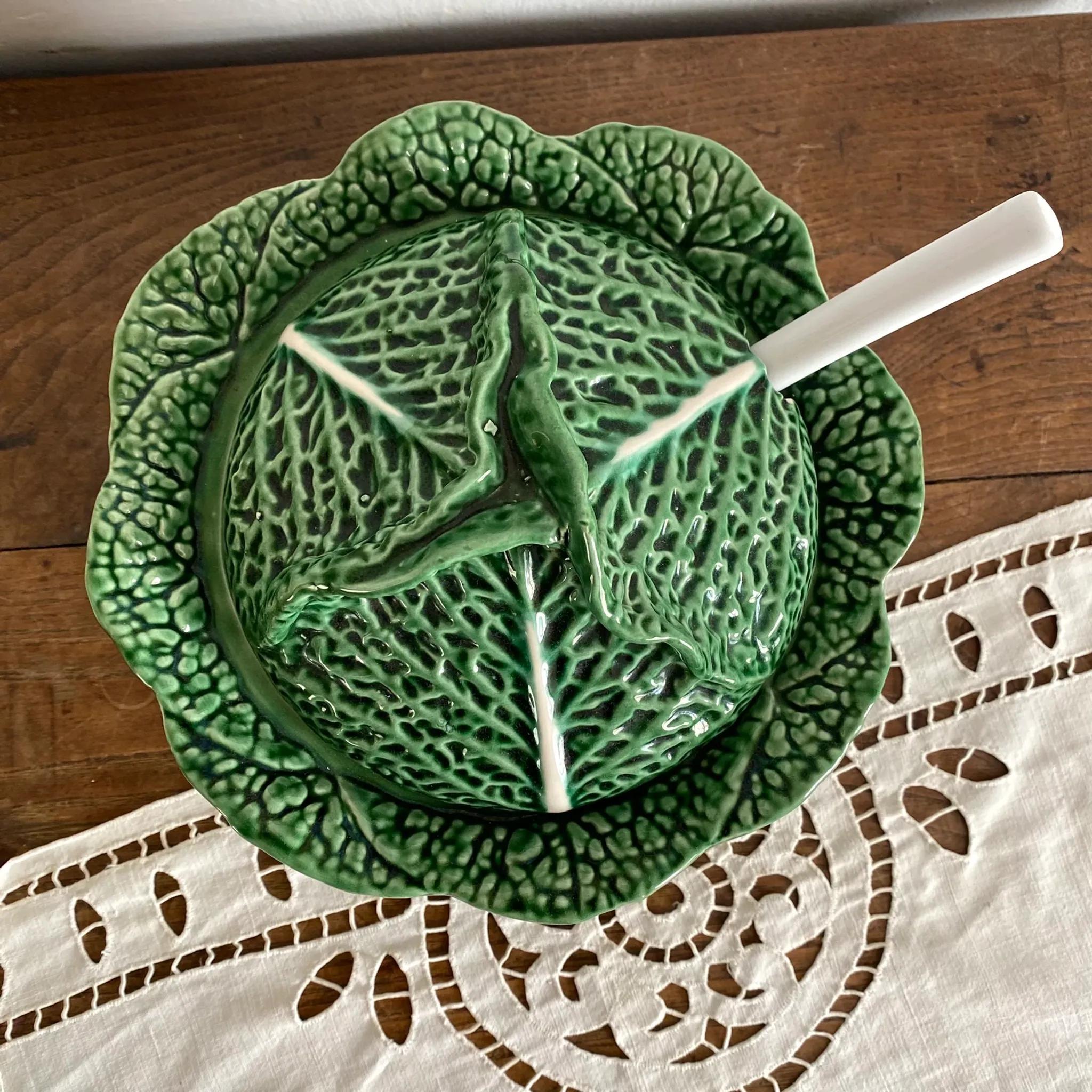 Large soup tureen in earthenware with a cabbage design, along with a dish and spoon.