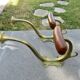 Pair of Art Nouveau coat hooks in bronze and chestnut, circa 1930.