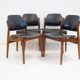 Set of four Arne Vodder chairs in hardwood and black leather.