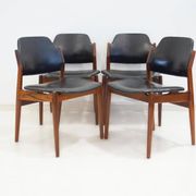 Set of four Arne Vodder chairs in hardwood and black leather.