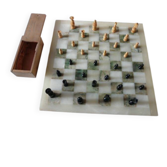 Onyx chessboard and complete wooden chess set.