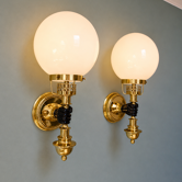 Pair of wall sconces in brass and white opaline, Hollywood Regency, 1970.