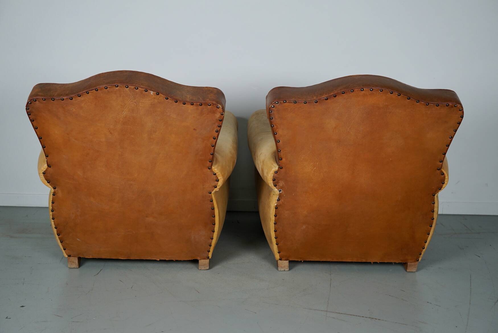 Pair of French Cognac Moustache Back Leather Club Chairs, 1940s