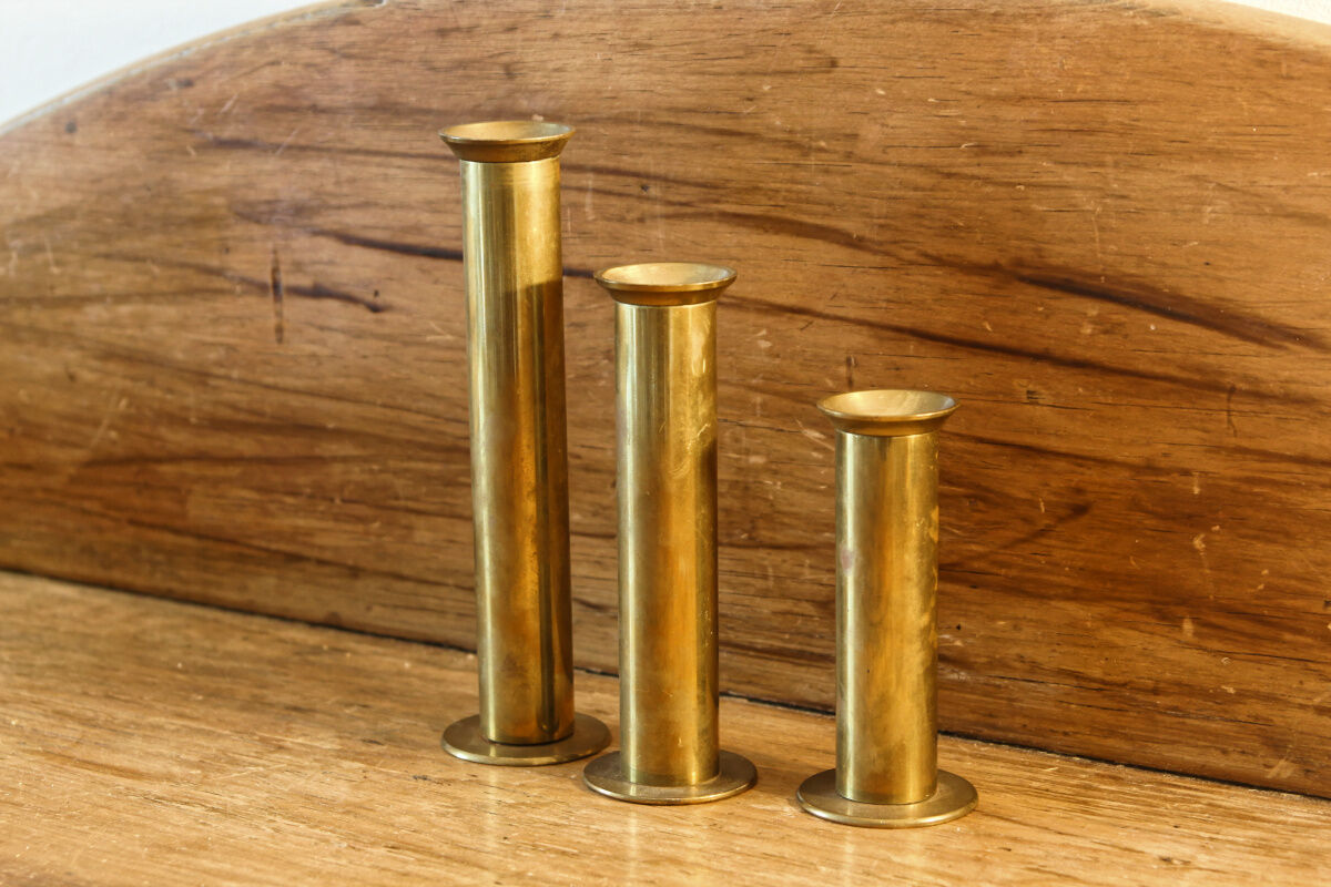 Trio of brass candle holders
