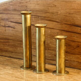 Trio of brass candle holders