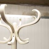 Parrot wears white Baumann coat 1970