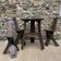 Brutalist style table and chairs, wine cellar.